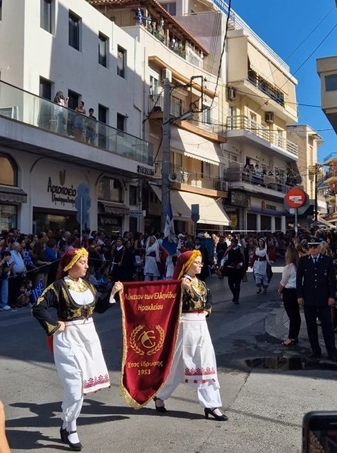 Cretan women and men in their traditional costumes